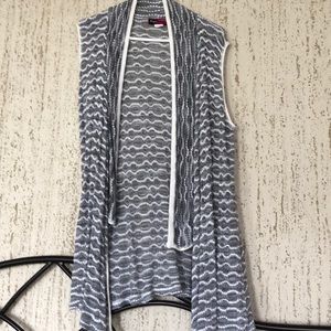 A grey and white vest